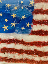 Close-up of red, wite and blue flag showing starfish in the blue as stars