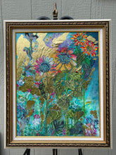 Framed abstract sunflower artwork with green fabric leaves and gold foil
