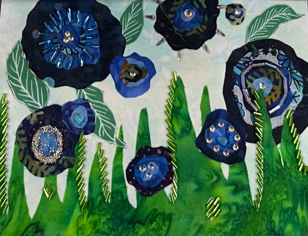 Garden-inspired floral wall art in fabric mixed media with layered flowers, green stems, and dimensional textile detail