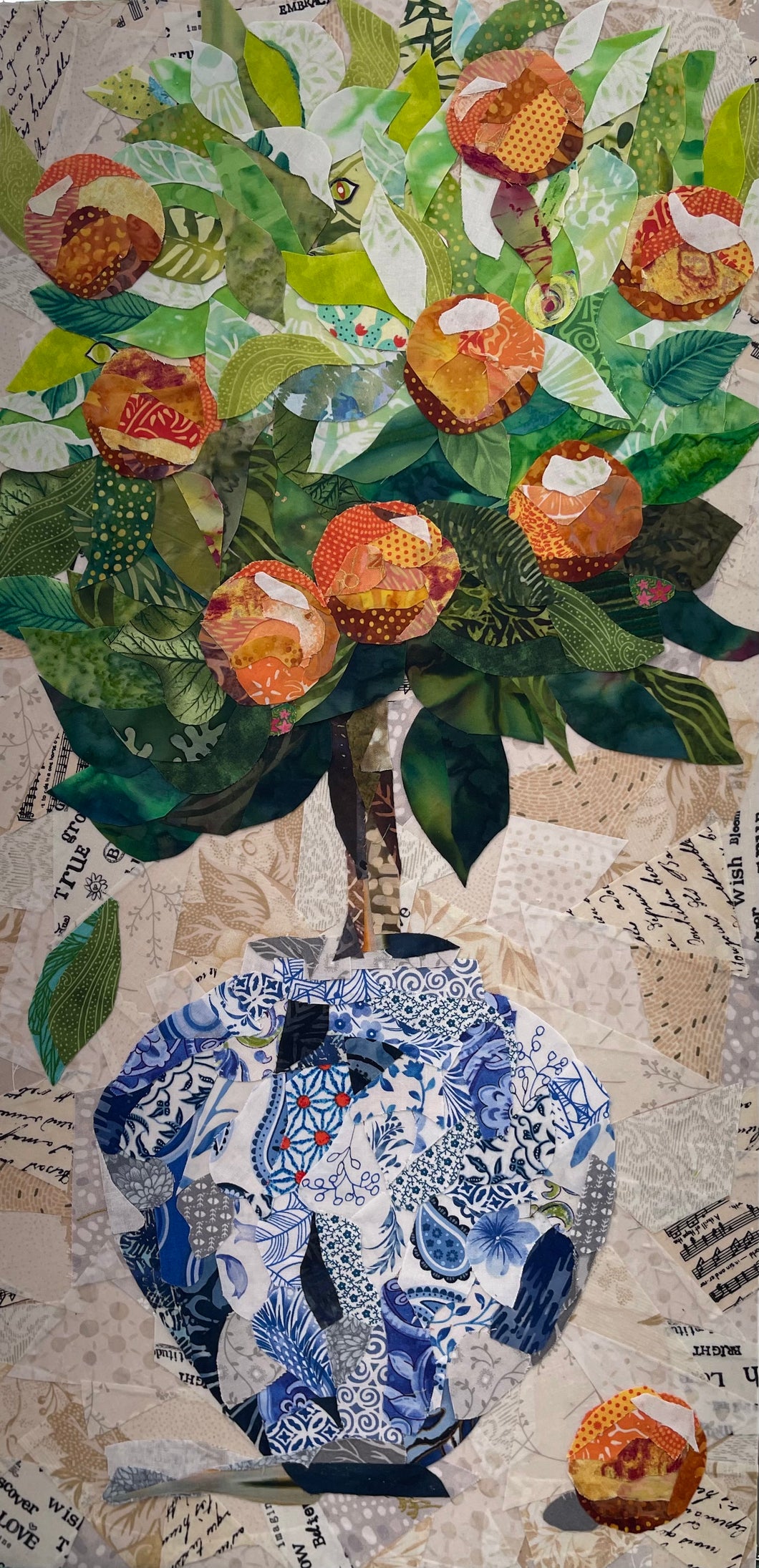 Fruit tree still life artwork with oranges in a Chinoiserie style patterned vase, created with layered fabric mixed media and dimensional detail