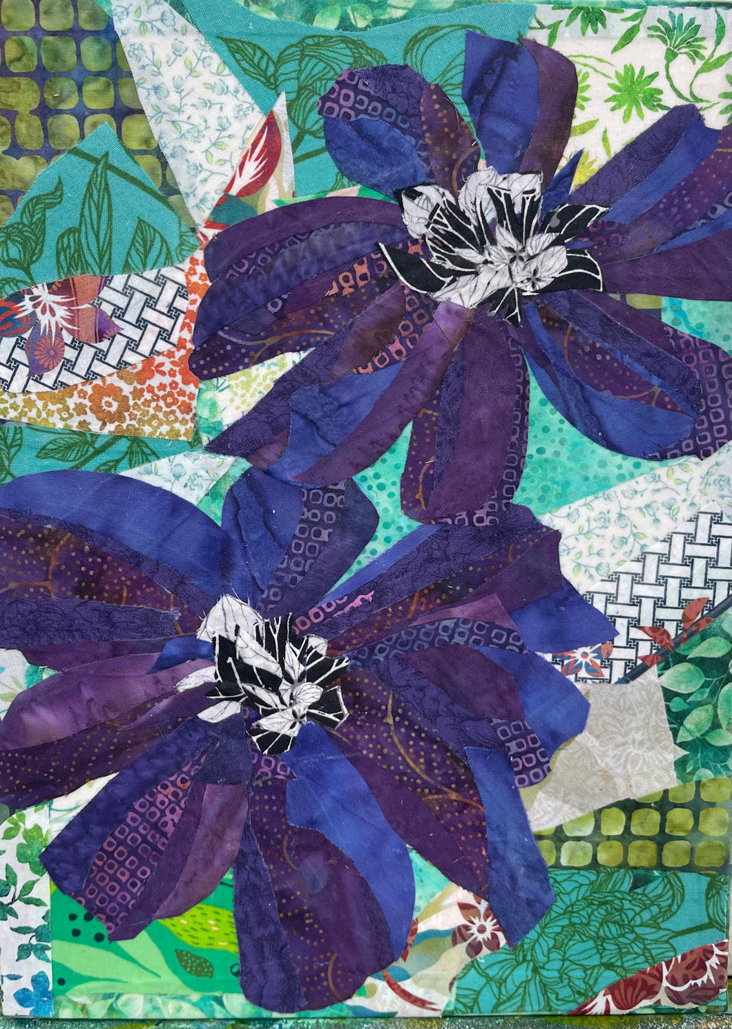 Botanical fabric mixed media wall art with layered purple flowers and textured textile collage background