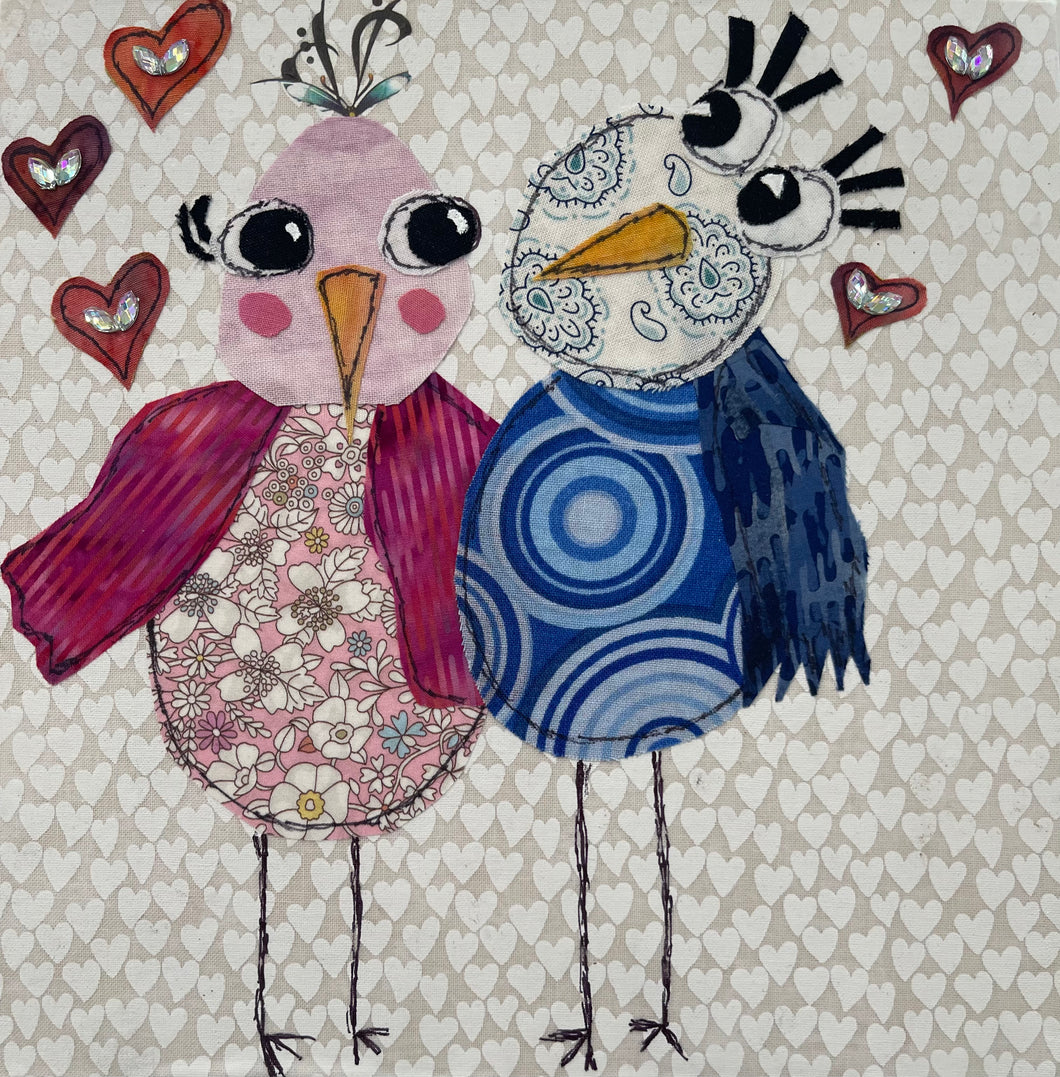 Whimsical bird textile art showing two colorful birds with hearts symbolizing love and companionship