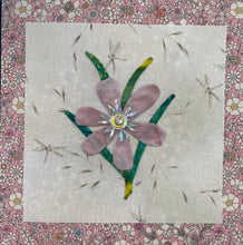 8 x 8 fabric collage artwork featuring a soft blush flower with a crystal center and green stems made from inherited textiles
