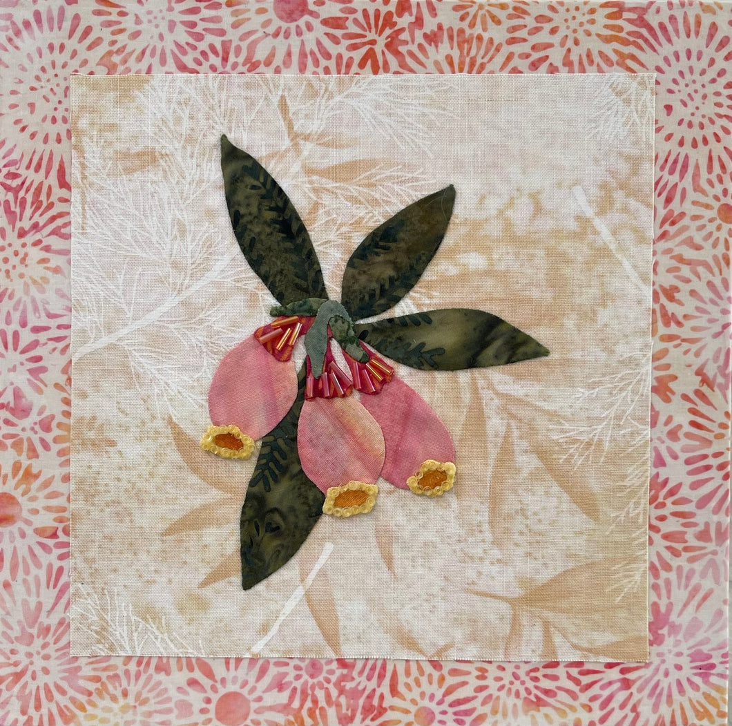 8 x 8 fabric collage artwork featuring soft blush flowers with gold accents and green leaves made from inherited textiles