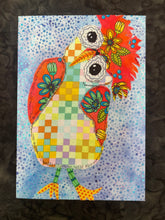 Colorful quirky fabric collage bird with patchwork body, floral wings, and large expressive eyes on a blue textured background read to hang