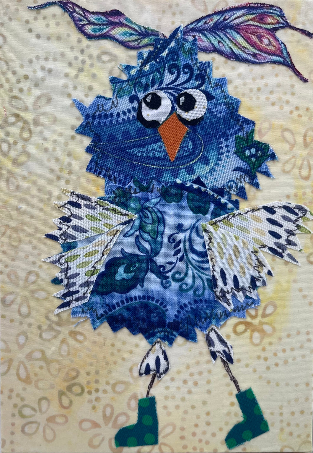 Whimsical blue owl fabric collage artwork with patterned wings and expressive eyes on an 8 x 8 birch panel