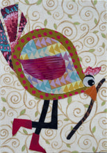 Whimsical fabric collage bird with colorful patterned body holding a walking stick, set against a soft swirling background