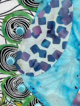 Close-up of colorful fabric with patterns and beads