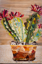 Original potted cactus fabric artwork 8x12 inches, three columnar cacti in patchwork amber rust terracotta fabric pot on fabric wheels with Czech glass bead detail Swarovski crystal blooms in deep magenta crimson pink fabric butterfly detail, wood grain and cream dotted background, birch panel, Floral Botanical Collection, Robyn Moore Arts
