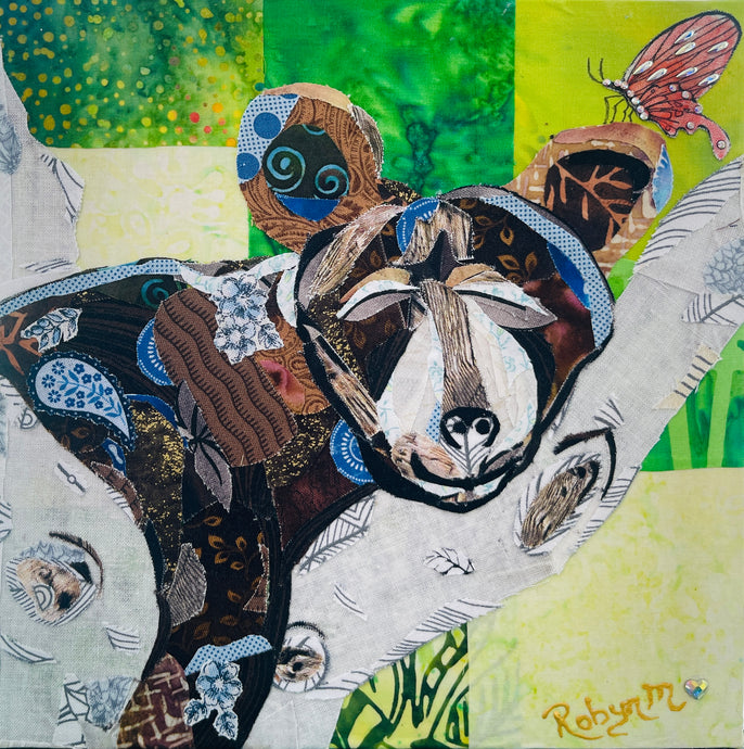 Original bear cub fabric artwork 8x8 inches, patchwork brown and tan bear cub resting on a branch with Swarovski crystal butterfly, green and yellow batik background, birch panel, Whimsical Companions Collection, Robyn Moore Arts