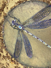 Close detail of Swarovski crystal dragonfly eyes and gold-veined paper wings on Inner World by Robyn Moore Arts, coarse gold metal flake texture surrounding a smooth clearing