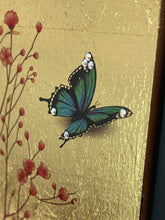 Close detail of Swarovski crystal wing butterfly on Quiet Landing by Robyn Moore Arts, watercolor image transfer berries on gold leaf
