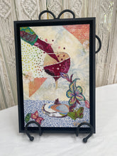 Original wine glass fabric artwork 8x12 inches, burgundy wine pouring into a glass with Swarovski crystal droplets, rainbow butterfly and floral accents, patchwork background, framed, Whimsical Companions Collection, Robyn Moore Arts