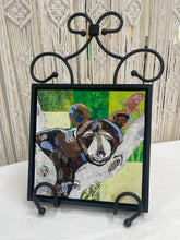 Original bear cub fabric artwork 8x8 inches, patchwork brown and tan bear cub resting on a branch with Swarovski crystal butterfly, green and yellow batik background, birch panel, Whimsical Companions Collection, Robyn Moore Arts