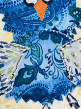 Close detail of Swarovski crystal accents on the painted feather wingtips and lower wing edge of A Little Offbeat by Robyn Moore Arts