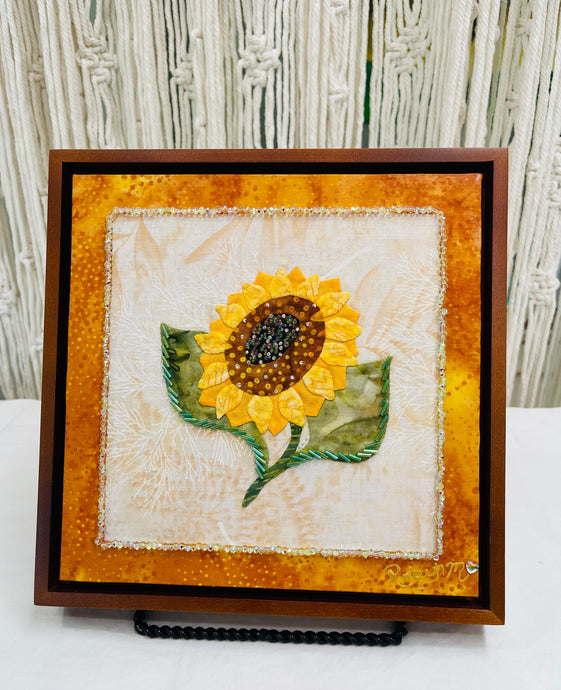 Sunflower art piece on fabric with a orange border