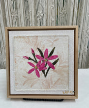 8 x 8 fabric collage artwork featuring pink flowers with crystal centers made from inherited textiles on neutral background