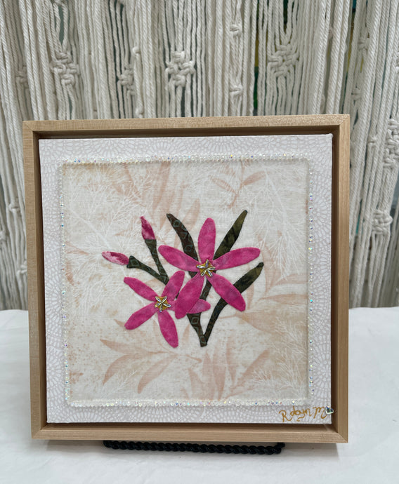 8 x 8 fabric collage artwork featuring pink flowers with crystal centers made from inherited textiles on neutral background