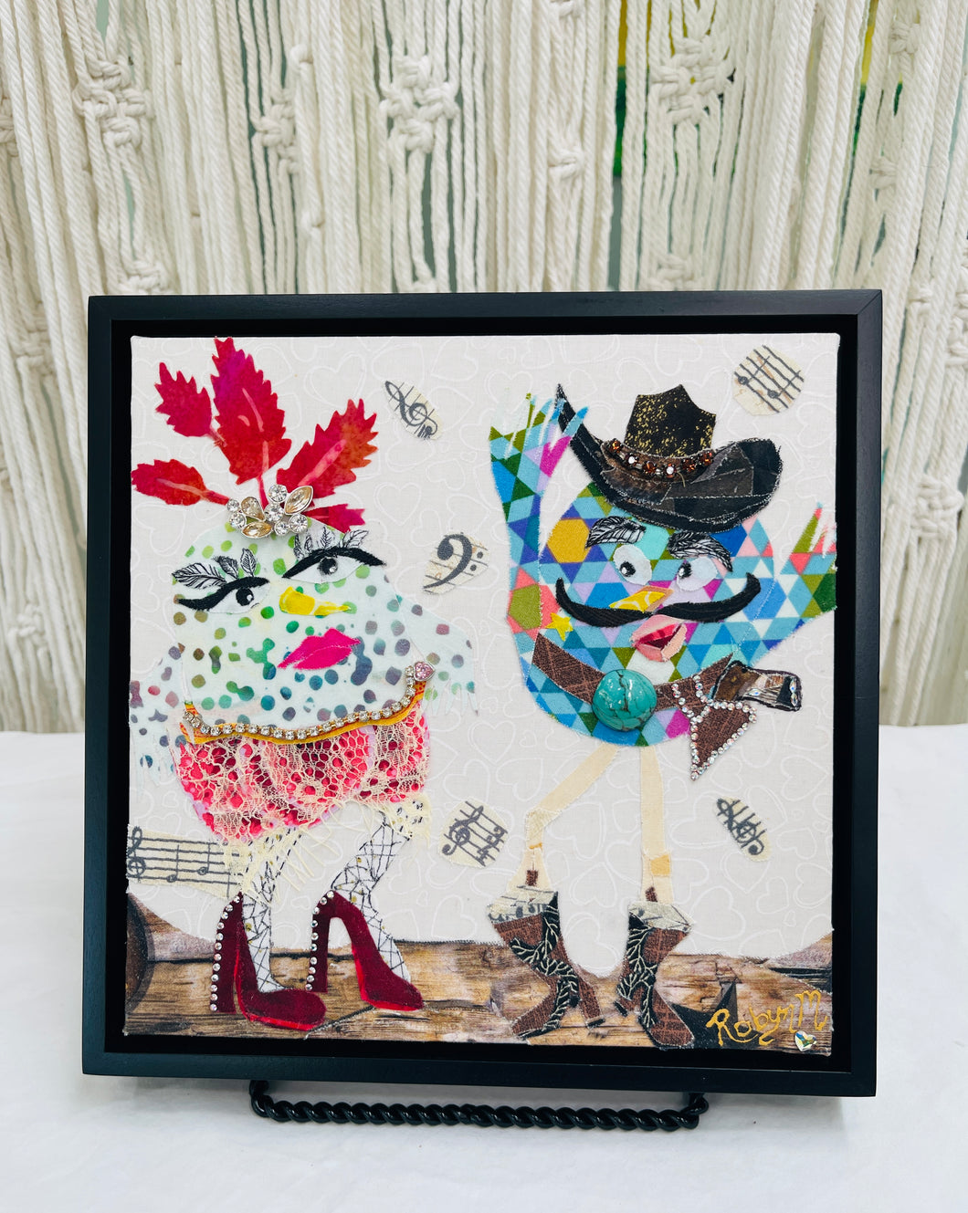 Original quirky bird duo fabric artwork 8x8 inches, glamorous bird with red leaf crown and rhinestone heels beside a cowboy bird in a jeweled hat, fabric music notes, birch panel, Whimsical Companions Collection, Robyn Moore Arts