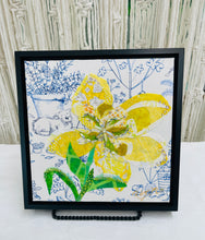 Yellow fabric flower artwork on 8x8 panel with layered textiles, Swarovski crystals, beads and green leaves on illustrated botanical background