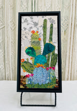 Original saguaro cactus fabric artwork 6x12 inches, tall saguaro in deep green fabric with prickly pear and pad cacti in chartreuse teal blue polka dot batik Swarovski crystal flowers scattered blooms ink pen spine detail, vintage toile botanical text background warm brown ground, birch panel, Floral Botanical Collection, Robyn Moore Arts