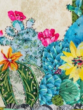 Close detail of Swarovski crystal bloom and Czech glass bead ridge work on Canyon Bloom by Robyn Moore Arts, crimson coral fabric bloom above silver bead-edged cactus pads