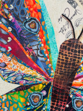 Close detail of a beaded eye-spot accent with Swarovski crystals along the fanned fabric wing on The Shape of Becoming by Robyn Moore Arts