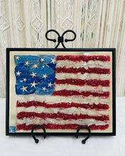 Liberty original American flag artwork created with recycled glass and epoxy resin featuring textured red stripes, translucent white layers, and vibrant blue stars on an 11 x 14 wood panel.