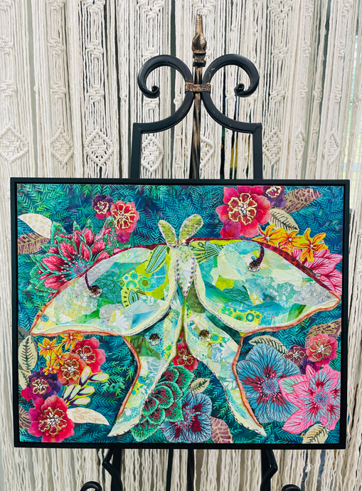 Original mixed media luna moth artwork 16x20 inches, large luna moth with patchwork fabric wings in sage, celadon and cream with gold foil detail, Swarovski crystals and Czech glass beads, set against a deep teal background of painted florals in magenta, crimson and blue, on birch panel, part of the Floral and Botanical and Whimsical Companions Collections