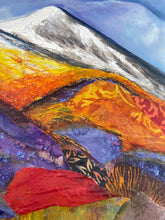 Close detail of layered fabric and acrylic texture on original mixed media mountain landscape painting Gathered Light by Robyn Moore Arts, showing patterned fabric embedded in rolling hillside in violet burnt orange and gold