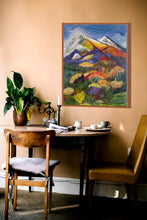 Original mixed media mountain landscape painting Gathered Light by Robyn Moore Arts displayed above a linen sofa in a warm cozy living room with natural wood tones