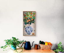 Original fabric botanical artwork Heavy with Sweetness by Robyn Moore Arts displayed on a kitchen or dining room wall above a wooden sideboard with ceramics and greenery