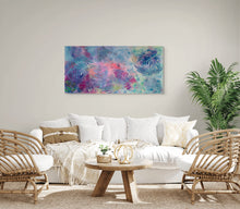Original large format botanical acrylic painting The Air Between Colors by Robyn Moore Arts displayed above a sofa on a wide horizontal wall in a boho coastal or light filled airy interior