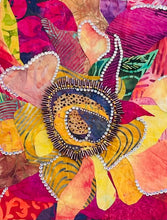 Close detail of crystal outlined petal edges and Czech glass bead center embellishment on original fabric botanical artwork Wild Bloom by Robyn Moore Arts, showing jewel like luminosity of bead and crystal work against batik fabric petals