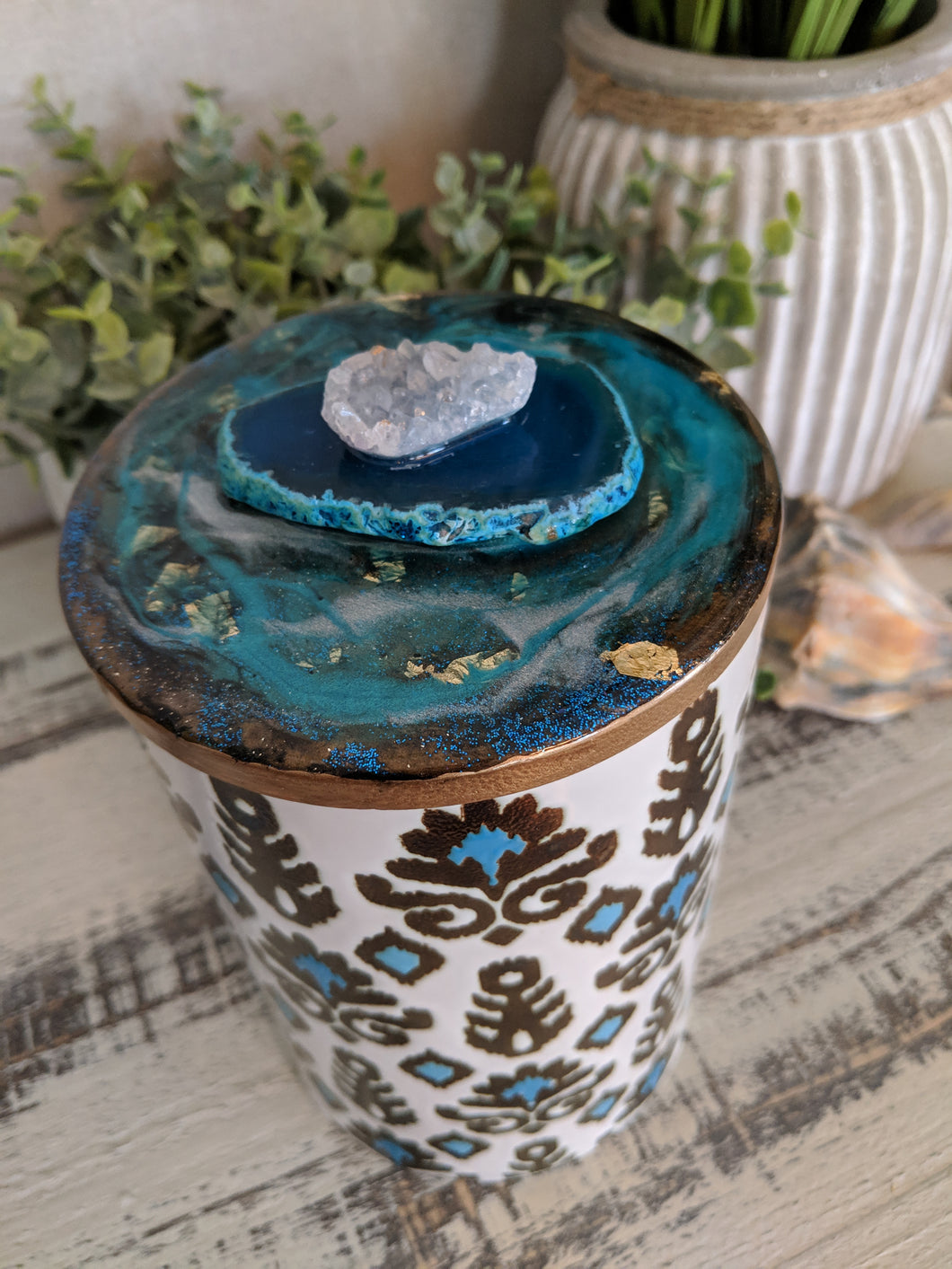 teal and brown canister with teal resin art lid and agate crystal