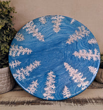 blue fluid lazy susan with silver foil pine trees