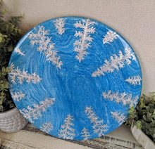 blue fluid lazy susan with silver foil pine trees