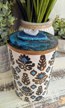 teal and brown canister with teal resin art lid and agate crystal