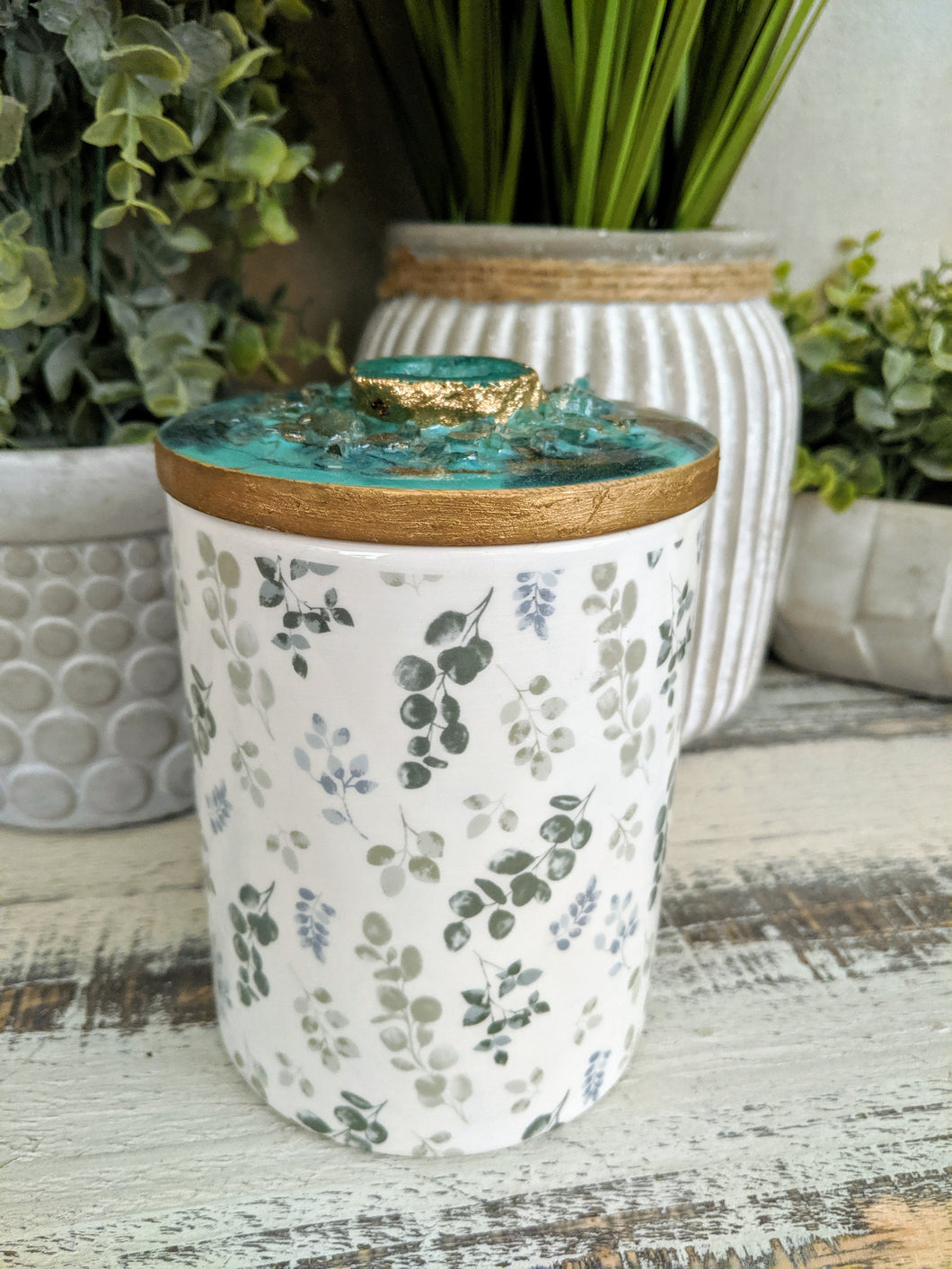 white and green floral candle with green teal gold agate lid