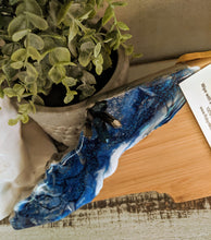 close up bamboo resin north carolina ocean cheeseboard in blues with crystals
