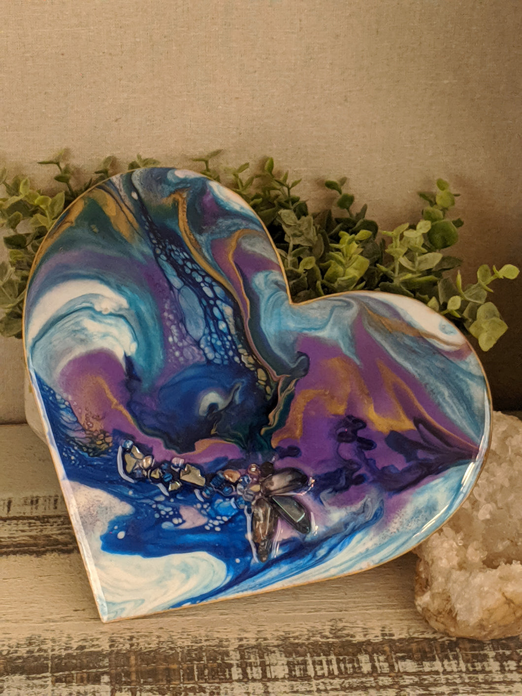 fluid resin heart painting with organic blue, teal, purple and white with gold and fire glass and crystal points