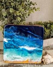wood trivet with abstract fluid resin in ocean colors blue teal white