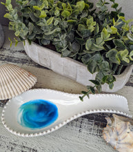 white ceramic spoon rest with ocean inspired resin