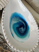 white ceramic spoon rest with ocean inspired resin