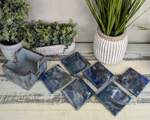 6 wood coasters with blue grey resin and holder