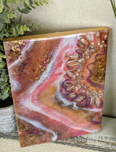 vibrant abstract resin art in orange white purple with crystals