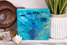 abstract fluid acrylic painting with vibrant blue green colors and flower