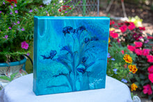 abstract fluid acrylic painting with vibrant blue green colors and flower