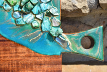 wood cheese board green resin art stones close up