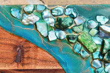 wood cheese board green resin art stones close up